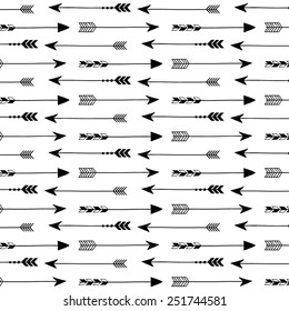 Tribal arrows on white background. Seamless vector pattern.