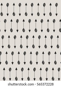 Tribal arrows pattern, Hand drawn seamless vector doodle background. Black arrows on beige background.
