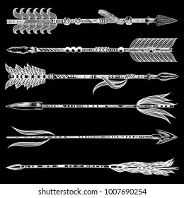 Tribal boho arrow set in ethnical pattern with feathers and bow. Native American Indian style. Hand drawn hipster illustration flesh tattoo black art work design concept. Vector.
