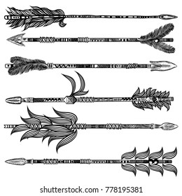 Tribal boho arrow set in ethnical pattern with feathers and bow. Native American Indian style. Hand drawn hipster illustration flesh tattoo black art work design concept. Vector.