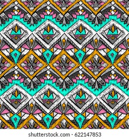 Tribal doodle pattern. Ethnic texture. Summer fabric design. Boho style fashion. Ethnic fabric. Scribble tribal shapes. Textile pattern. Native seamless ornament for clothes or interior textile.