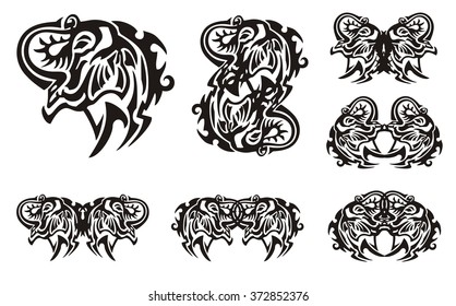 Tribal elephant head symbols. Muzzle of an elephant with the trunk lifted up and symbols from it