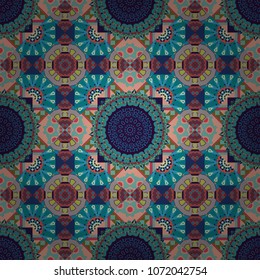 Tribal ethnic arabic, indian, turkish patern ornament. Vector traditional oriental background in green, brown and blue colors. Seamless pattern with the pre-existing geometry in the drawing.