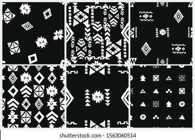 Tribal ethnic backgrounds. Stylish primitive geometric seamless pattern set. Trendy print grunge texture vector illustration. Monochrome fabric textile. White on black