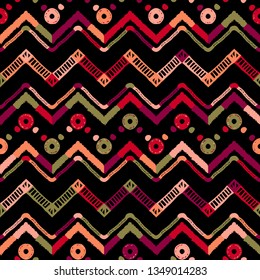 Patrón de folklore de la etnia tribal Ikat. Ornamento abstracto africano. Impresión de moda vectorial. Tapa de patrón sin inconvenientes. Fondo vectorial de chevron retro. Textura decorativa folclórica geométrica