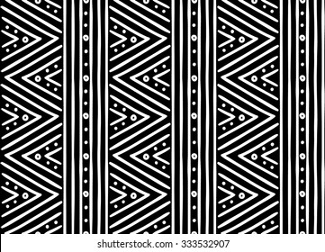 Tribal ethnic seamless african pattern. Vector illustration for print, textile design and background. White stripes and dots on a black background in african style. Stylish decoration, ornament.