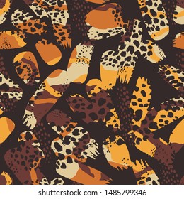 Tribal ethnic seamless pattern with animal print and brush strokes. Hand made effect. Vector background