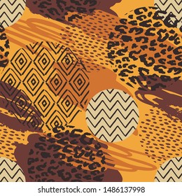 Tribal ethnic seamless pattern with animal print and brush strokes. Hand made effect. Vector background