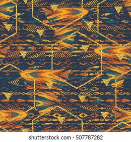 Tribal ethnic seamless pattern with geometric elements and gold glitter texture.  Vector background for paper, cover, fabric, interior decor and other users.