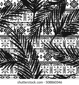 Tribal ethnic seamless pattern with geometric elements and palm leaves. Vector background