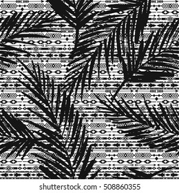 Tribal ethnic seamless pattern with geometric elements and palm leaves. Vector background