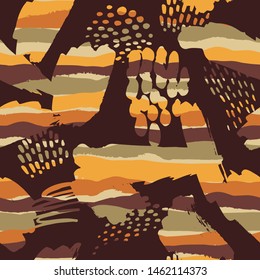 Tribal ethnic seamless pattern with strokes and splashes. Hand made effect. Vector background