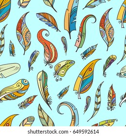 Tribal feathers in boho style. Vector fashion seamless pattern