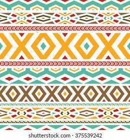 Tribal / Folk seamless pattern. Boho style fashion background with indian ornament elements, grunge effect. Vector illustration.