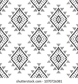 Tribal graphic design. Textured geometric shape in a clean black and white palette. Ethnic seamless pattern for modern home decor. American indian navajo rug.