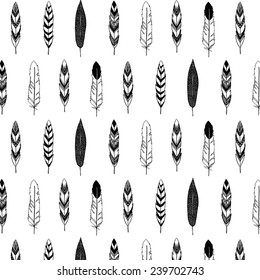 Tribal hand drawn feathers on white background. Seamless vector pattern.