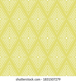 Tribal Ikat pattern. Yellow and white elegant seamless background. Vector illustration in boho style. Fashion textile print.