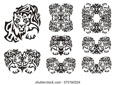 Tribal leopard symbols. Set of the double flaming symbols of the head of a young leopard. Black on the white