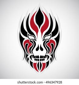 Tribal mask tattoo