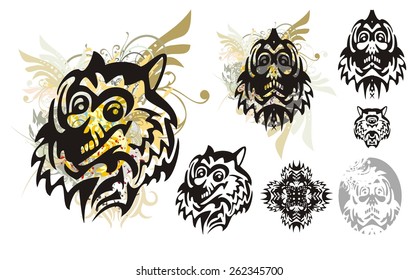 Tribal monster wolf head with splashes and the head of the monster. Set of the heads of the monster for a carnival. Tribal grunge wolf head with floral splashes and blood drops