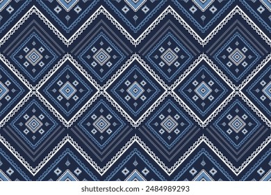Tribal ornament. Geometric pattern. Ethnic pattern. Seamless pattern in navy blue background. Design for ikat, blanket, fabric, clothing, carpet, textile, ethnic, batik, embroidery.