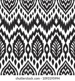 Tribal pattern. Seamless background. Scribble texture. Black and white graphic design. Creative vector illustration. Ethnic boho ornament. Impressive fashion print.