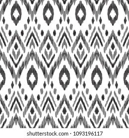 Tribal pattern. Seamless background. Scribble texture. Black and white graphic design. Creative vector illustration. Ethnic boho ornament. Impressive fashion print.