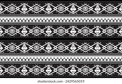 Tribal pattern showcases cultural richness Tribal inspired monochrome pattern. Perfect for textiles, fashion, and home decor, adding unique charm.Its symmetrical and geometric tribaltradition 