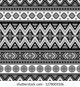 Tribal striped seamless pattern. Aztec geometric black-white background. Can be used in fabric design for clothes, accessories; decorative paper, wrapping, web design, etc. Vector illustration