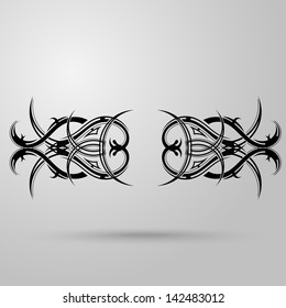 Tribal tattoo on a gray background with shadow