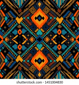 Tribal vector ornament. Seamless African pattern. Ethnic carpet with chevrons. Aztec style. Geometric mosaic on the tile, majolica. Ancient interior. Modern rug. Geo print on textile. Kente Cloth.