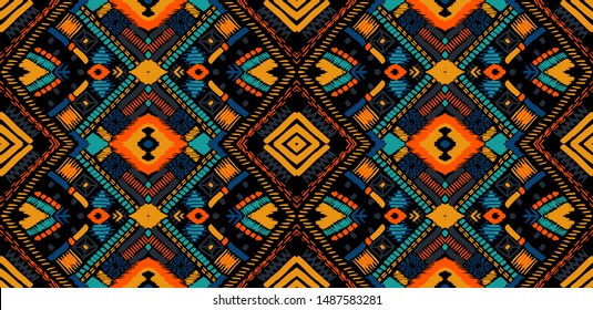 Tribal vector ornament. Seamless African pattern. Ethnic carpet with chevrons. Aztec style. Geometric mosaic on the tile, majolica. Ancient interior. Modern rug. Geo print on textile. Kente Cloth.