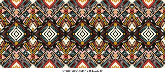 Tribal vector ornament. Seamless African pattern. Ethnic carpet with chevrons. Aztec style. Geometric mosaic on the tile, majolica. Ancient interior. Modern rug. Geo print on textile. Kente Cloth.