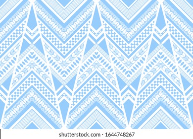 Tribal vector seamless pattern with chevrons and stripes. Blue and white ethnic background. Abstract geometric wallpaper, cloth, textile, fabric, wrapping, cover, carpet, card design. 