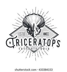 Triceratops logo template. Dinosaur logotype. Dino tattoo studio design. Vector bone crest label. Jurassic period sunburst illustration. Fury Dino insignia concept. Ancient world badge.