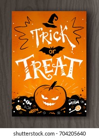 Trick or Treat Halloween postcard design with lettering, pumpkin and candies on wood background.