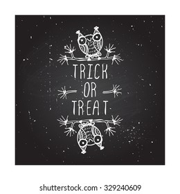 Trick or treat - halloween poster. Hand-sketched typographic element with cute little owls on chalkboard background.  