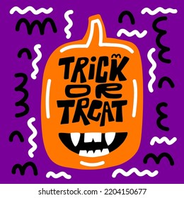 Trick or treat lettering and creepy pumpkin with fangs