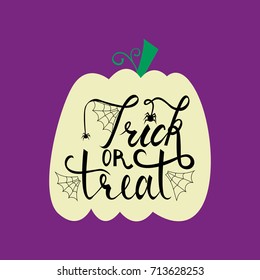 Trick or treat modern brush inscription on pumpkin. Illustrated phrase for Halloween.