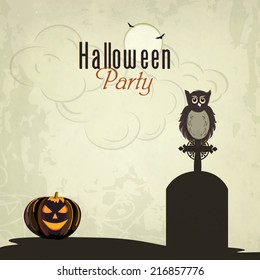 Trick or Treat night party concept with little owl sitting on grave stone, scary pumpkins and spider web on grungy background. 