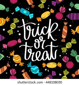 Trick or treat. The trend calligraphy. Vector illustration on a black background with different sweet candy. Excellent holiday card.