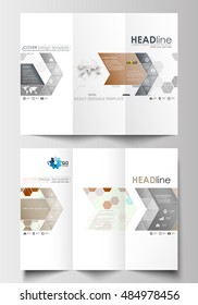 Tri-fold brochure business templates on both sides. Easy editable layout in flat design. Abstract gray color background, modern stylish hexagonal vector texture.