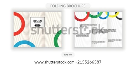trifold brochure with colored rings.