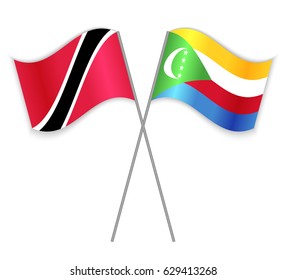 Trinidadian and Comoran crossed flags. Trinidad and Tobago combined with Comoros isolated on white. Language learning, international business or travel concept.