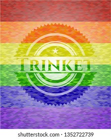 Trinket emblem on mosaic background with the colors of the LGBT flag