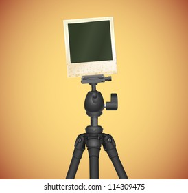 tripod with old photo frame