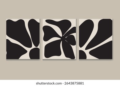 A triptych of canvas prints features a stylized floral design. The artwork is in black and white, with bold, simplified floral shapes on a creamy off-white background. Each panel shows variations