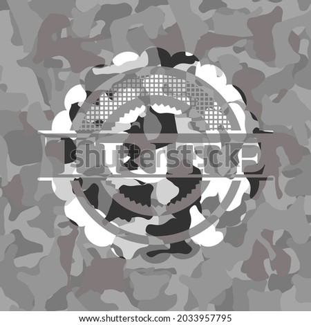 Trite written on a grey camouflage texture 