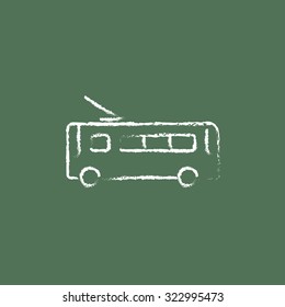 Trolleybus hand drawn in chalk on a blackboard vector white icon isolated on a green background.