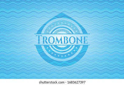 Trombone light blue water wave badge. Vector Illustration. Detailed.